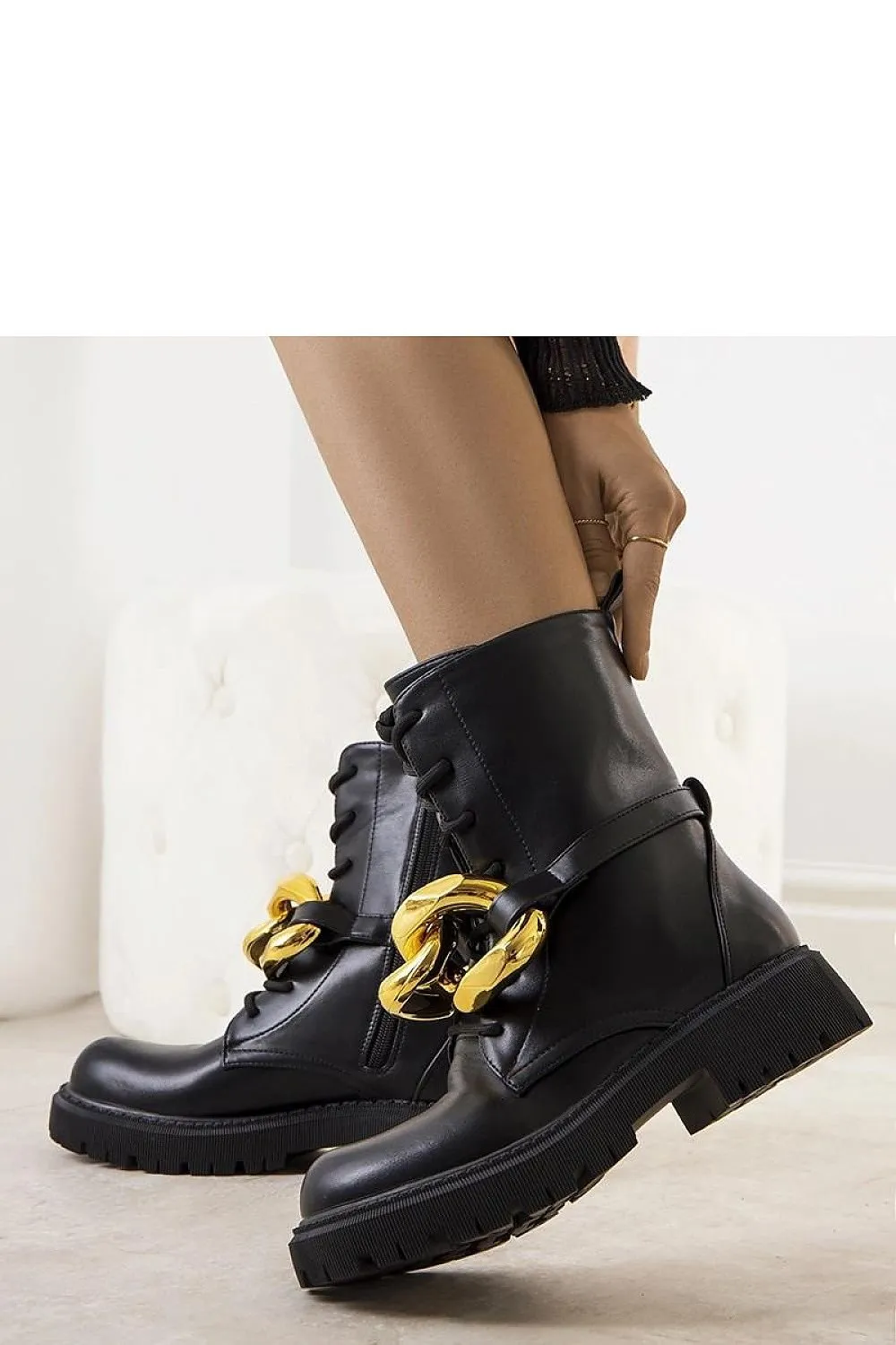 Beige boots with a chain